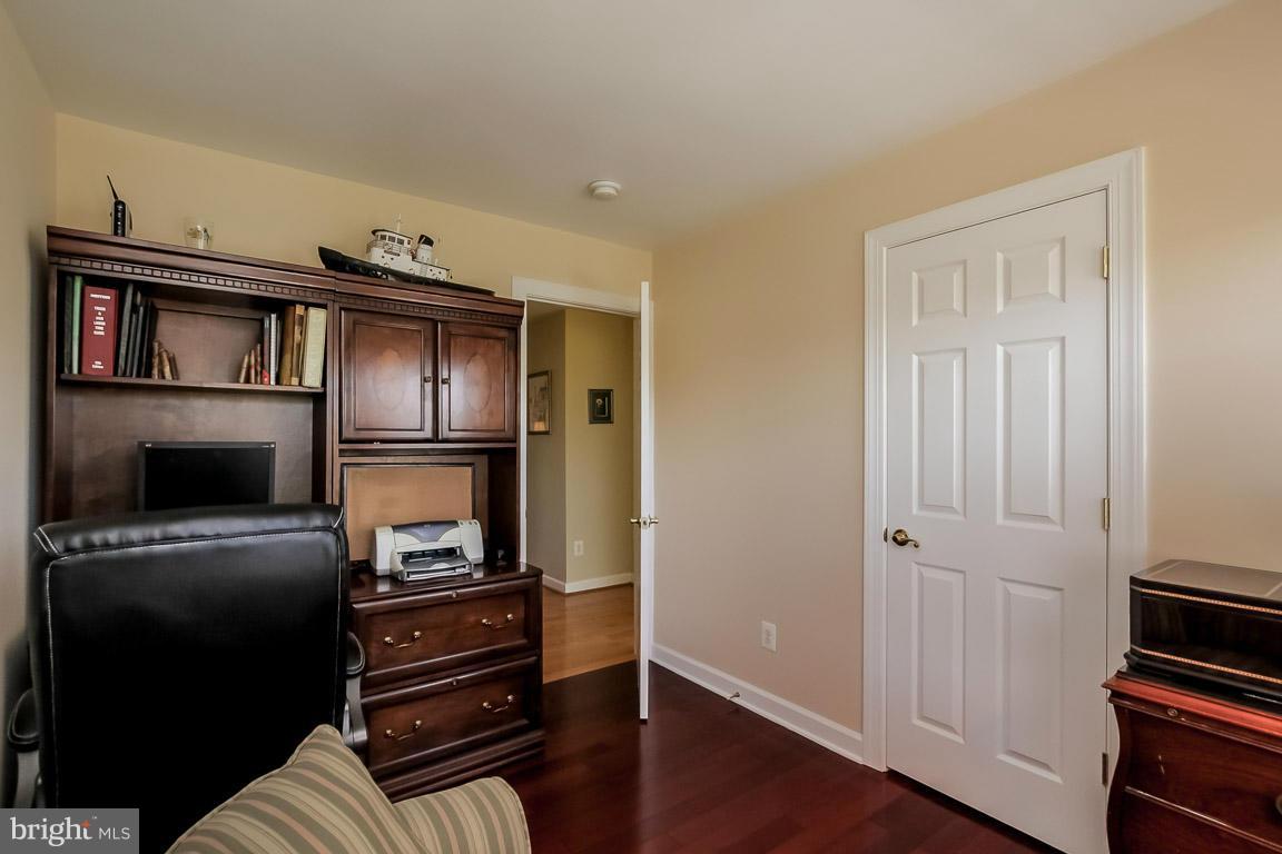 15626 Avocet Loop Woodbridge, VA 22191 - Photo 22 of 30 a kitchen with a refrigerator and a stove top oven
