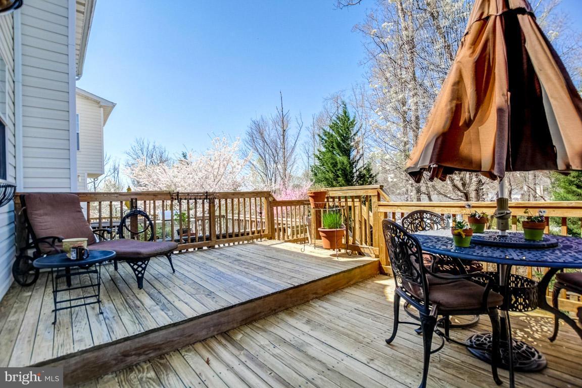 15626 Avocet Loop Woodbridge, VA 22191 - Photo 26 of 30 a view of a deck with furniture and a barbeque