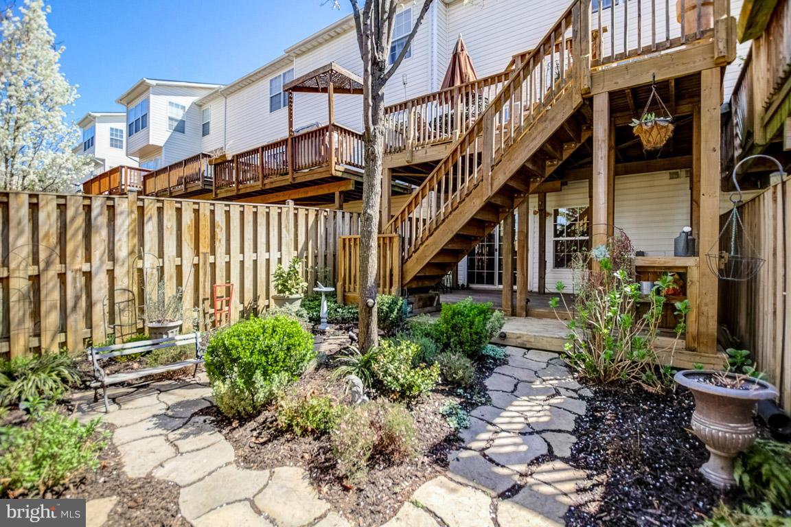15626 Avocet Loop Woodbridge, VA 22191 - Photo 28 of 30 a view of a house with a yard and potted plants