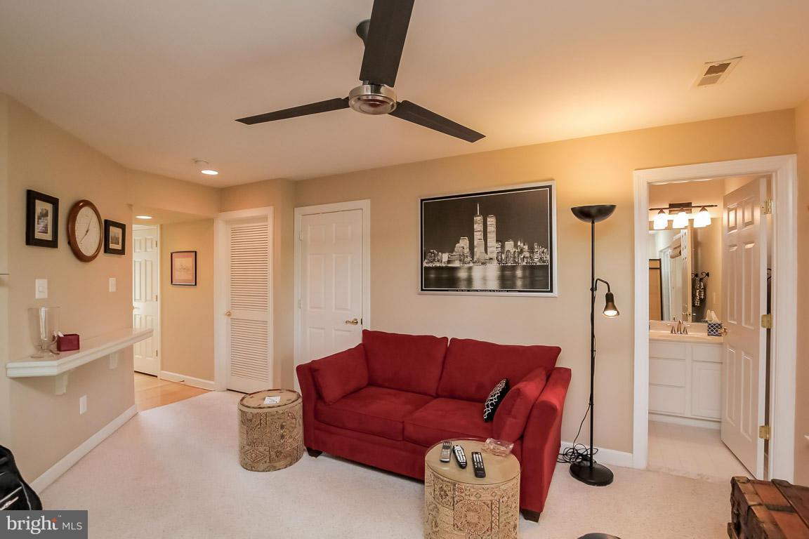 15626 Avocet Loop Woodbridge, VA 22191 - Photo 6 of 30 a living room with furniture and a ceiling fan