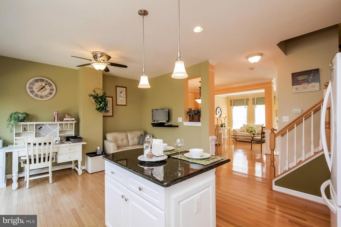 15626 Avocet Loop Woodbridge, VA 22191 - Photo 10 of 30 a living room with furniture a table and wooden floor