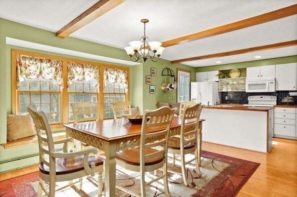 32 Thorpe Road Needham, MA 02494 - Photo 3 of 20 a dining room filled chandelier and wooden floor
