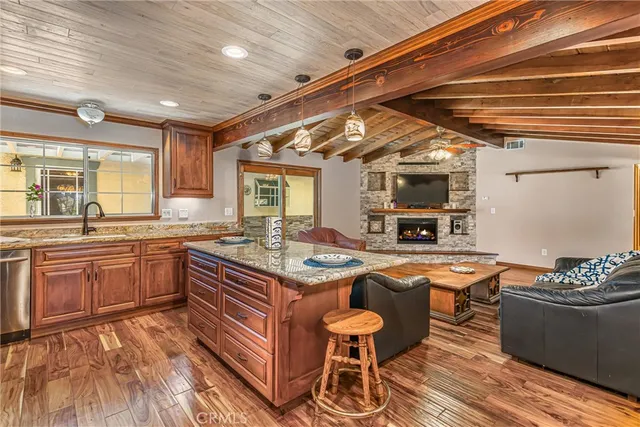 a kitchen with stainless steel appliances granite countertop a sink and cabinets