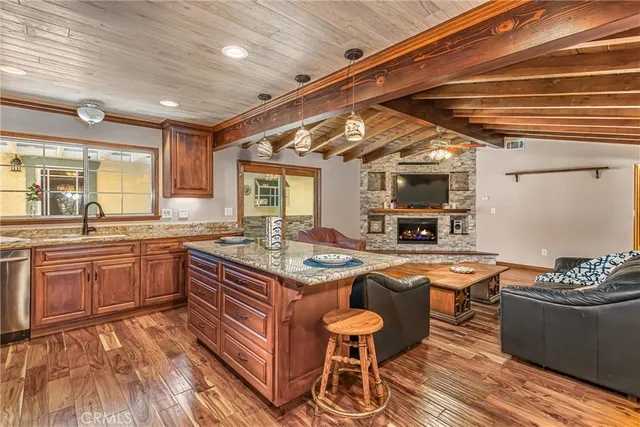 a kitchen with stainless steel appliances granite countertop a sink and cabinets