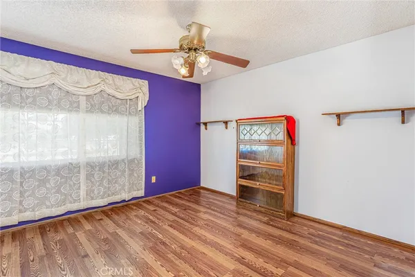 a view of a room with a ceiling fan