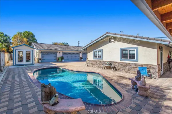 a view of a backyard with a patio