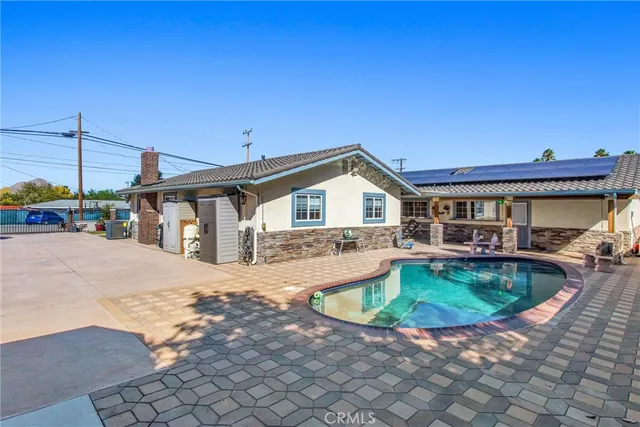a view of a backyard with a patio