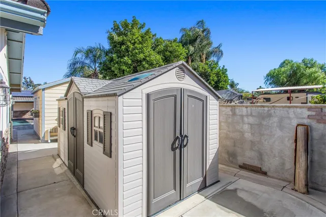 a view of an empty room with window and fireplace