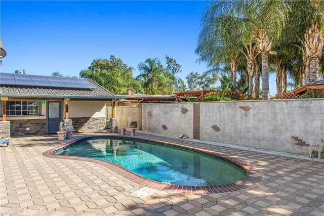 an empty room with a stove and a window