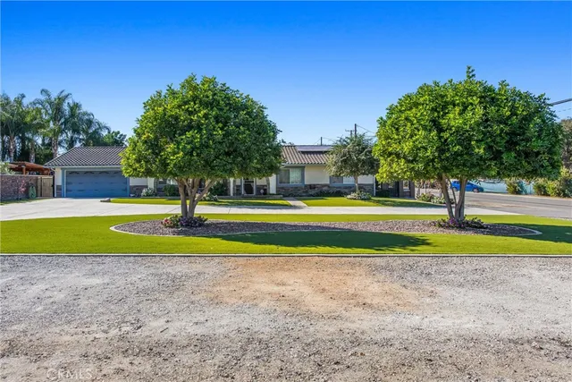 a view of a swimming pool with a yard