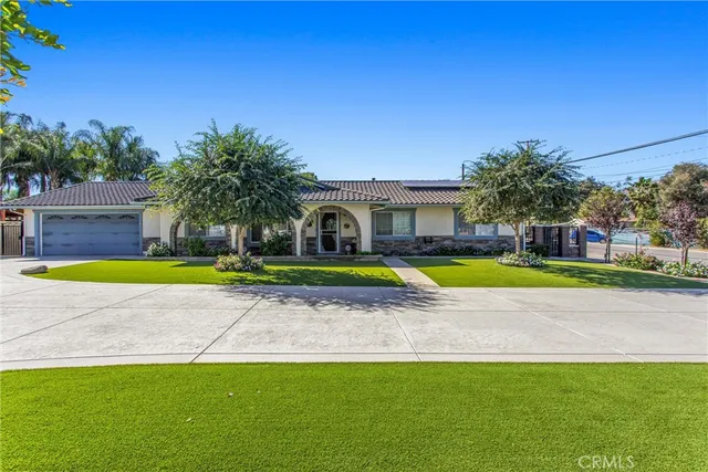 a view of a swimming pool with a house in the background