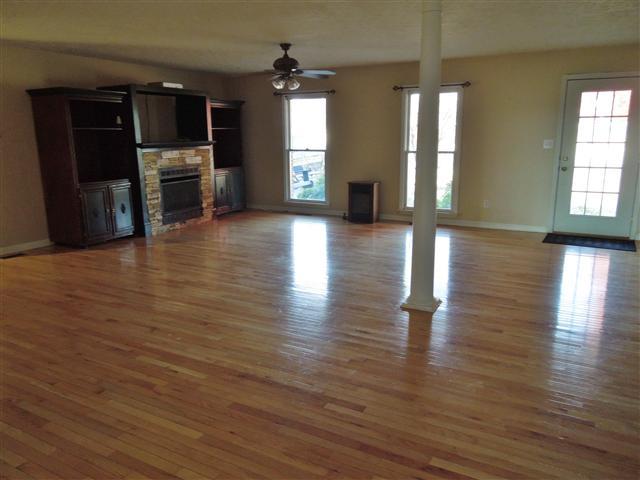 635 Hurricane Loop Tennessee Ridge, TN 37178 - Photo 8 of 20 Huge Gathering Room - nice gas logs unit, hardwood flooring - combination dining area.