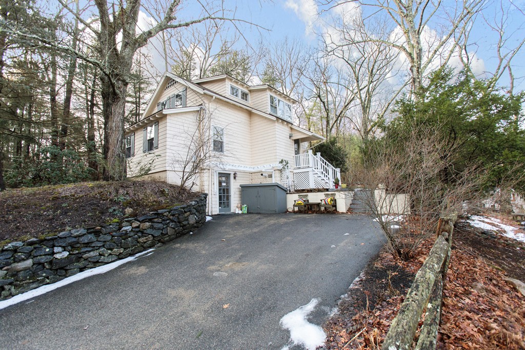 38 Conant Road Weston, MA 02493 - Photo 1 of 19 a view of a house with a snow in the yard