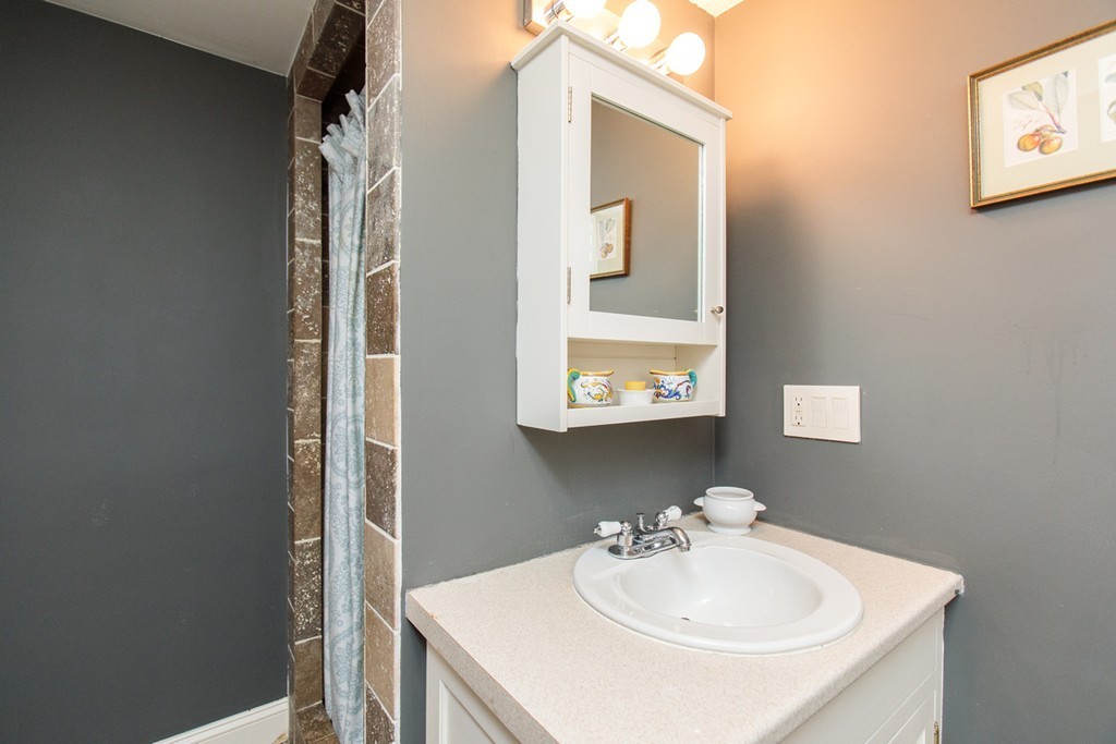 38 Conant Road Weston, MA 02493 - Photo 12 of 19 a bathroom with a sink and a mirror