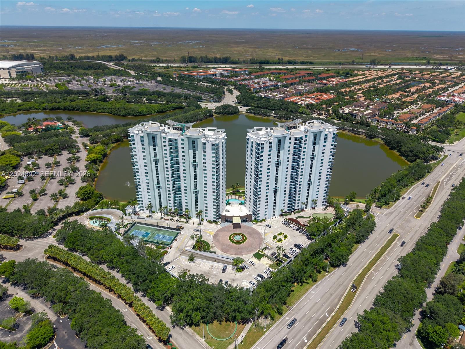 2641 North Flamingo Road, Unit 2605N Sunrise, FL 33323 - Photo 55 of 56 a view of a house with a yard and lake view