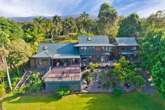 an aerial view of a house with a garden