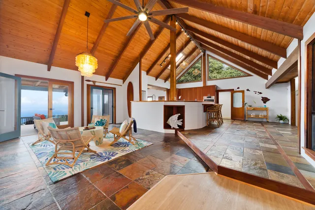 a view of a patio with a table and chairs