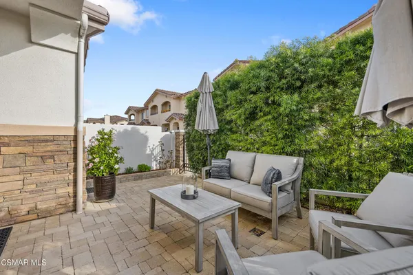 a outdoor space with patio the couches and a potted plant