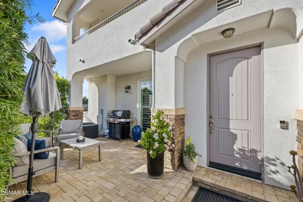 a lobby with furniture and potted plant