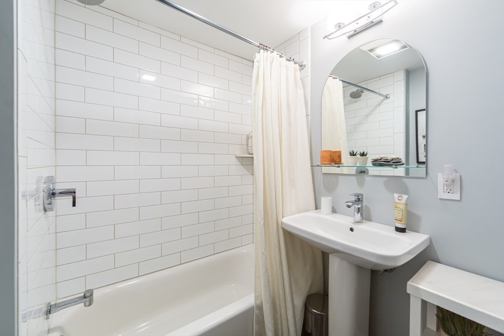 1 Lincoln Street Extension Natick, MA 01760 - Photo 20 of 31 a bathroom with a sink and a mirror