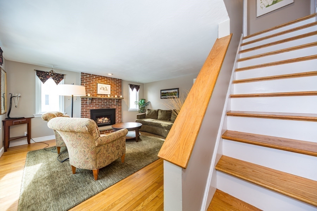 1 Lincoln Street Extension Natick, MA 01760 - Photo 22 of 31 a living room with furniture and a fireplace