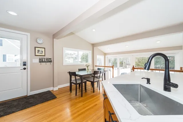 a view of a kitchen with kitchen island a large window and living room