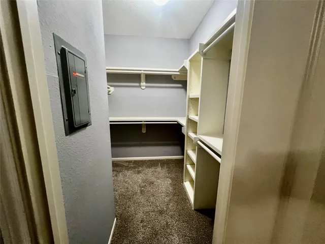 a hallway with storage and utility