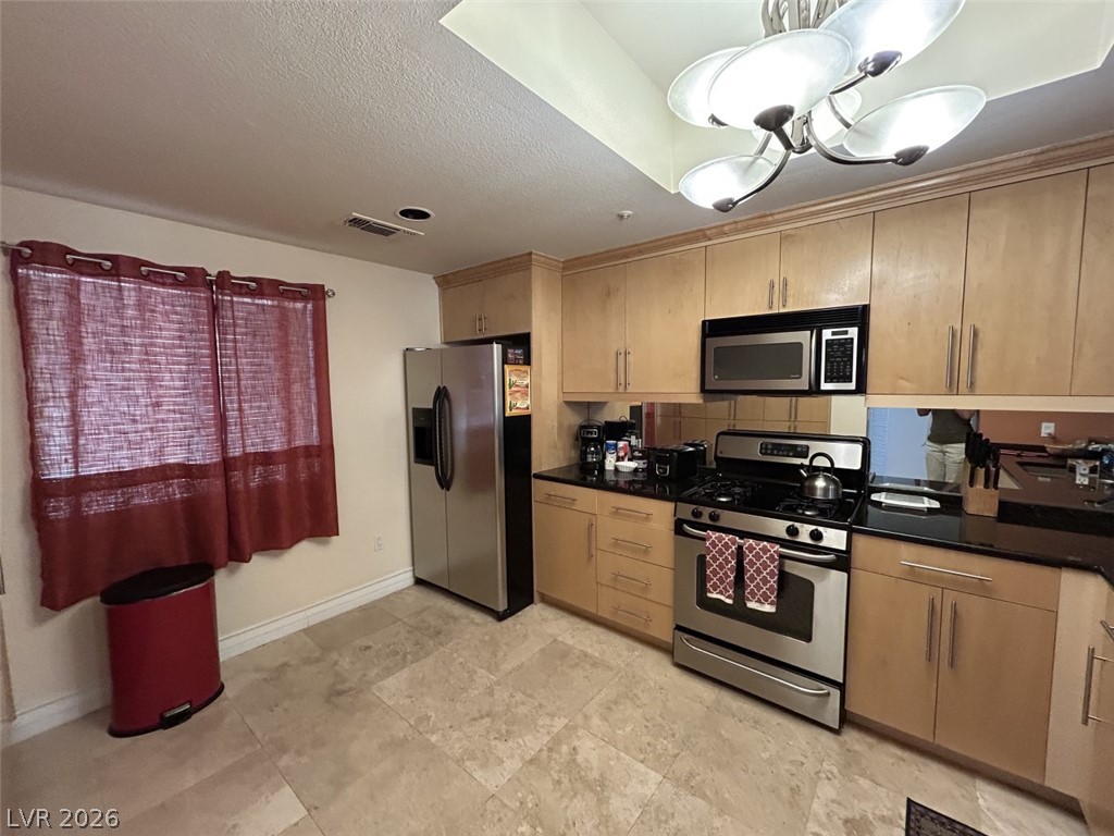 210 East Flamingo Road, Unit 137 Las Vegas, NV 89169 - Photo 5 of 32 Culinary aspirations come alive with stainless steel appliances and ample counter space.