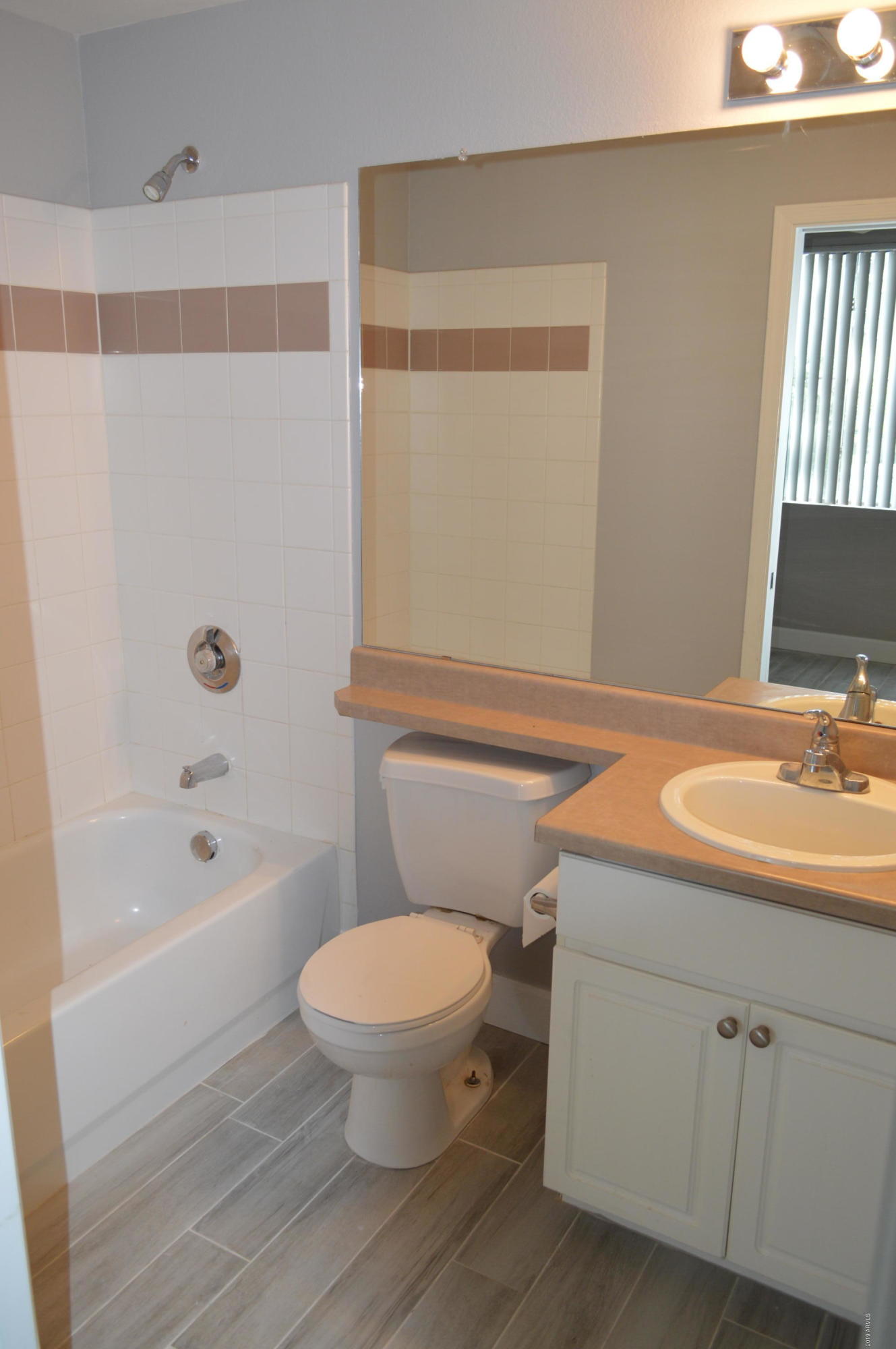 1701 East Colter Street, Unit 184 Phoenix, AZ 85016 - Photo 11 of 41 a bathroom with a sink toilet and shower