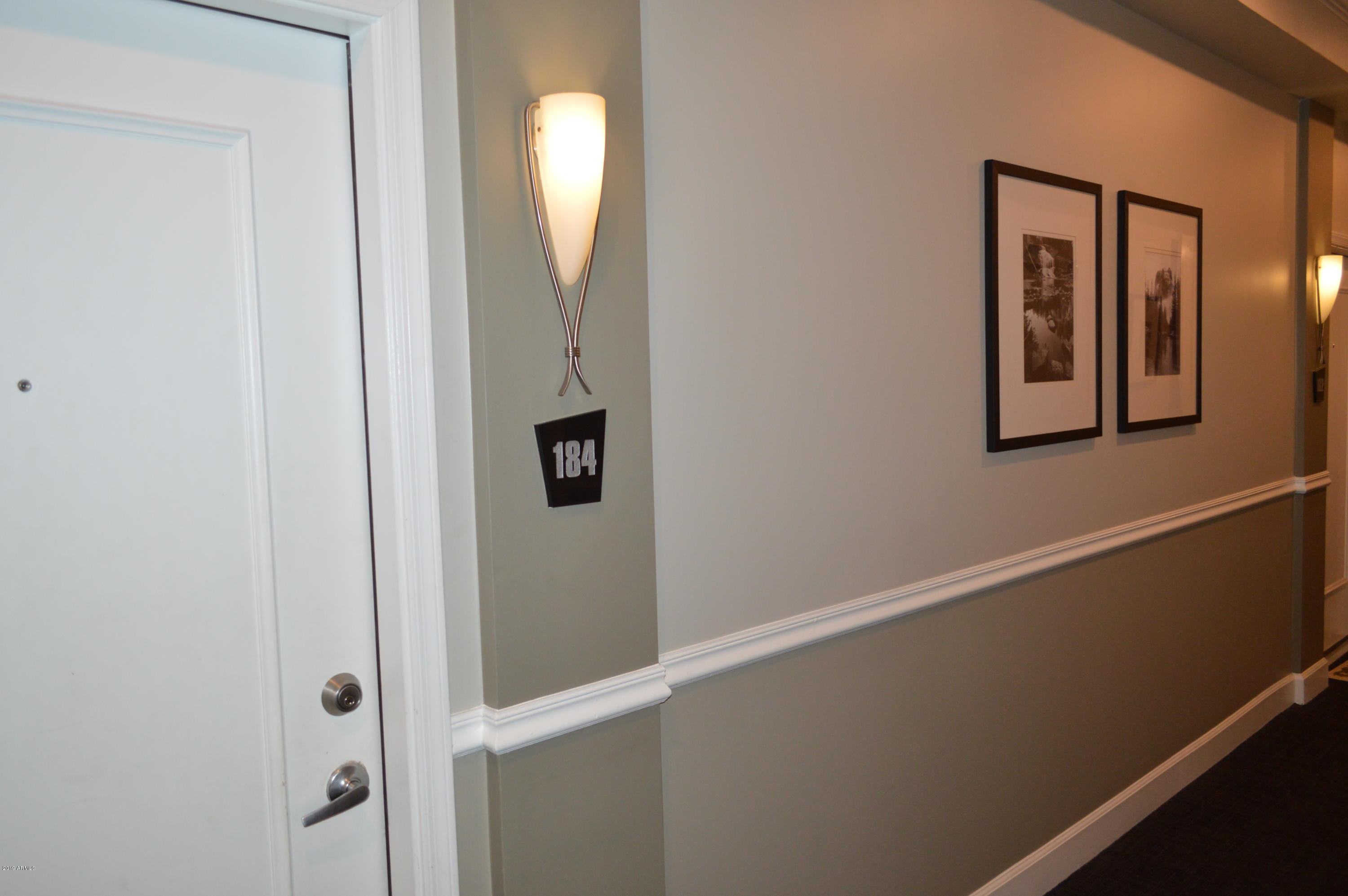 1701 East Colter Street, Unit 184 Phoenix, AZ 85016 - Photo 13 of 41 a view of a hallway with front door