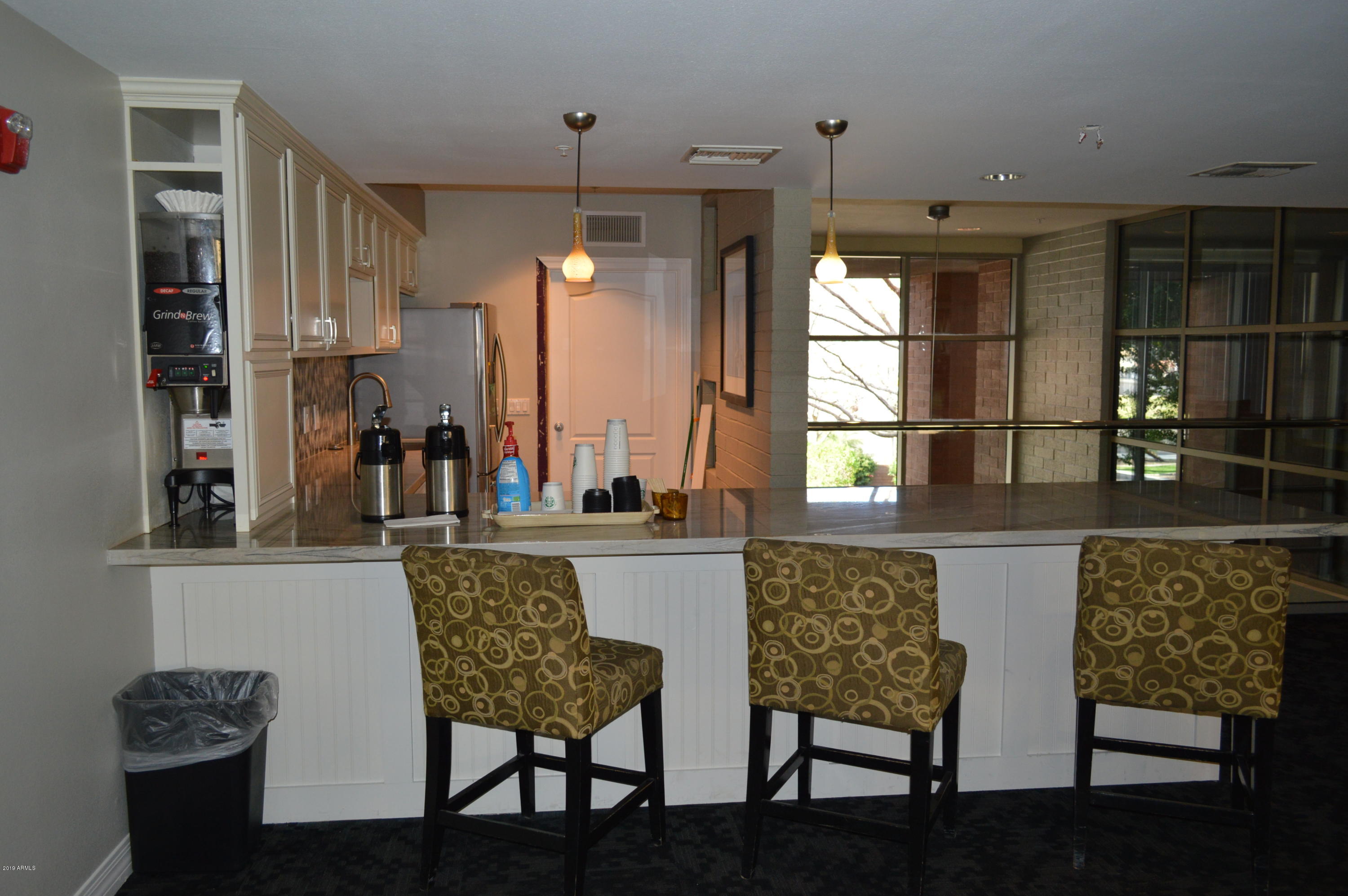 1701 East Colter Street, Unit 184 Phoenix, AZ 85016 - Photo 20 of 41 a dining room with furniture and window