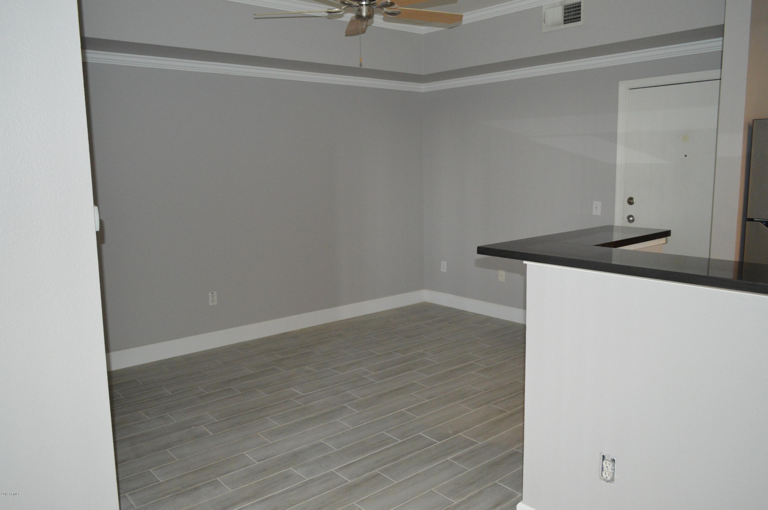 1701 East Colter Street, Unit 184 Phoenix, AZ 85016 - Photo 2 of 41 a view of a storage and utility room with wooden floor