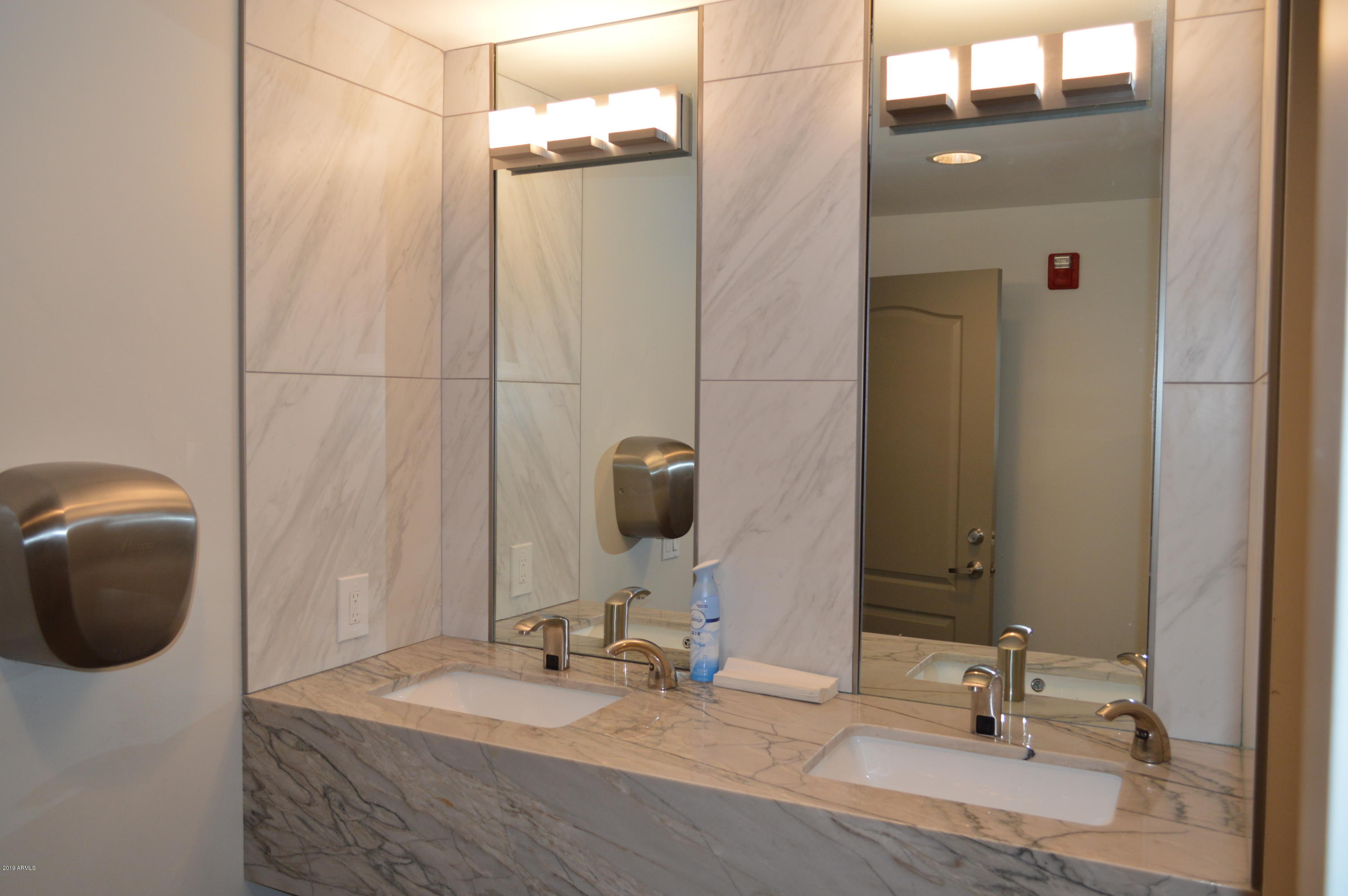 1701 East Colter Street, Unit 184 Phoenix, AZ 85016 - Photo 24 of 41 a bathroom with a sink and a mirror