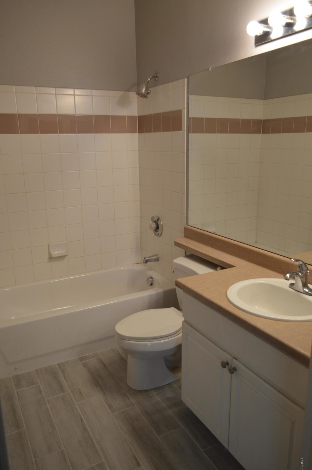 1701 East Colter Street, Unit 184 Phoenix, AZ 85016 - Photo 8 of 41 a bathroom with a sink a toilet and shower