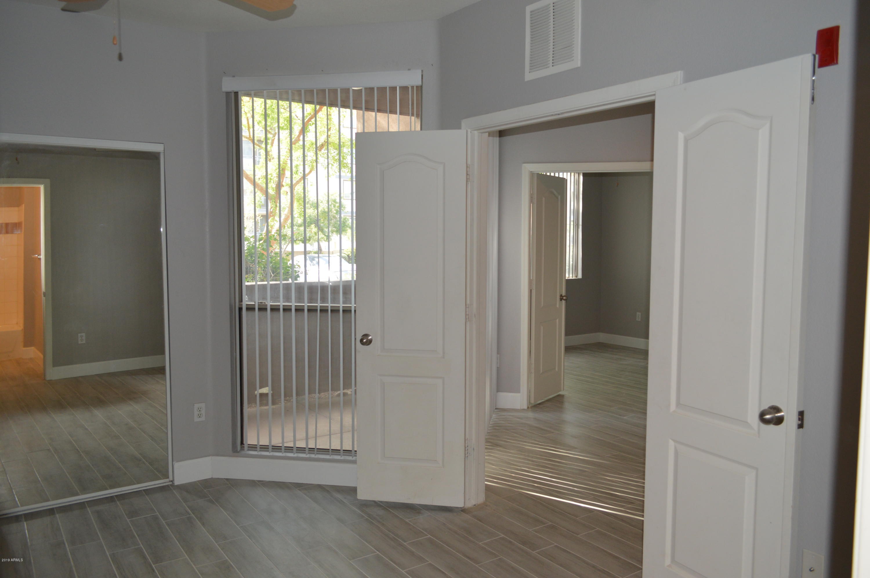 1701 East Colter Street, Unit 184 Phoenix, AZ 85016 - Photo 9 of 41 a view of entryway with wooden floor