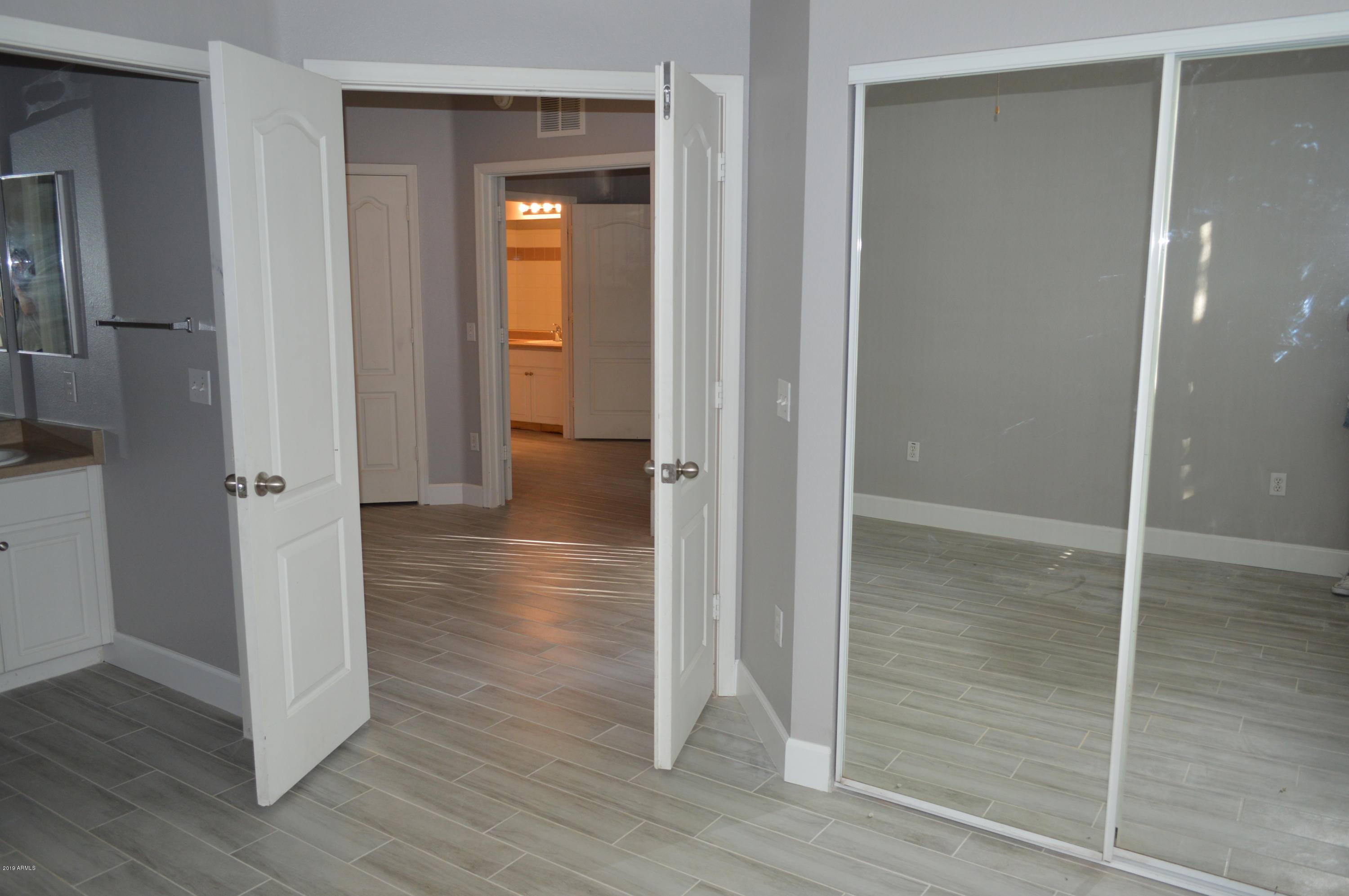 1701 East Colter Street, Unit 184 Phoenix, AZ 85016 - Photo 10 of 41 a view of a hallway with wooden floor