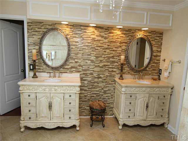 7601 Vista Del Rey Lane Raleigh, NC 27613 - Photo 14 of 24 Separate vanities, and lots of tile in the master bathroom. Not pictured is a tile walk-in shower. Master Bath/Spa