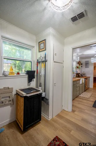 a view of kitchen with stainless steel appliances granite countertop a stove and a refrigerator