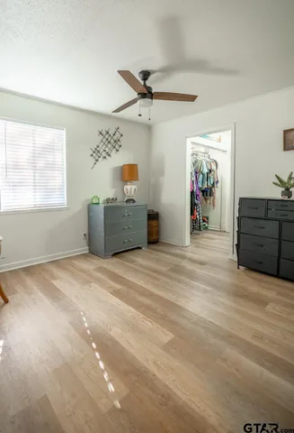a view of a livingroom with furniture and a window