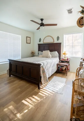 a bedroom with a bed and a window