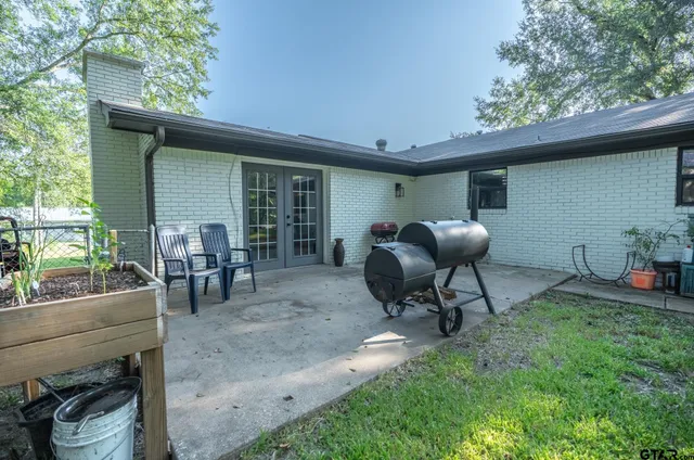 a view of a backyard with furniture