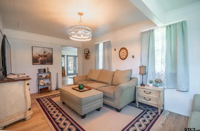 a living room with furniture and a table