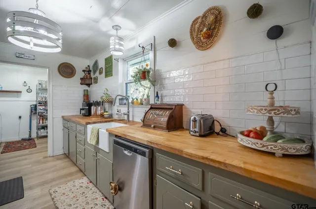 a kitchen with sink and cabinets
