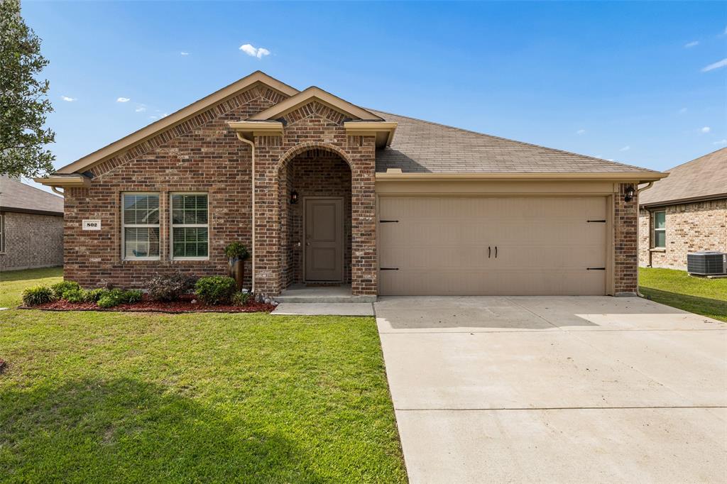 802 Rustic Way Royse City, TX 75189 - Photo 36 of 38 a front view of a house with a yard