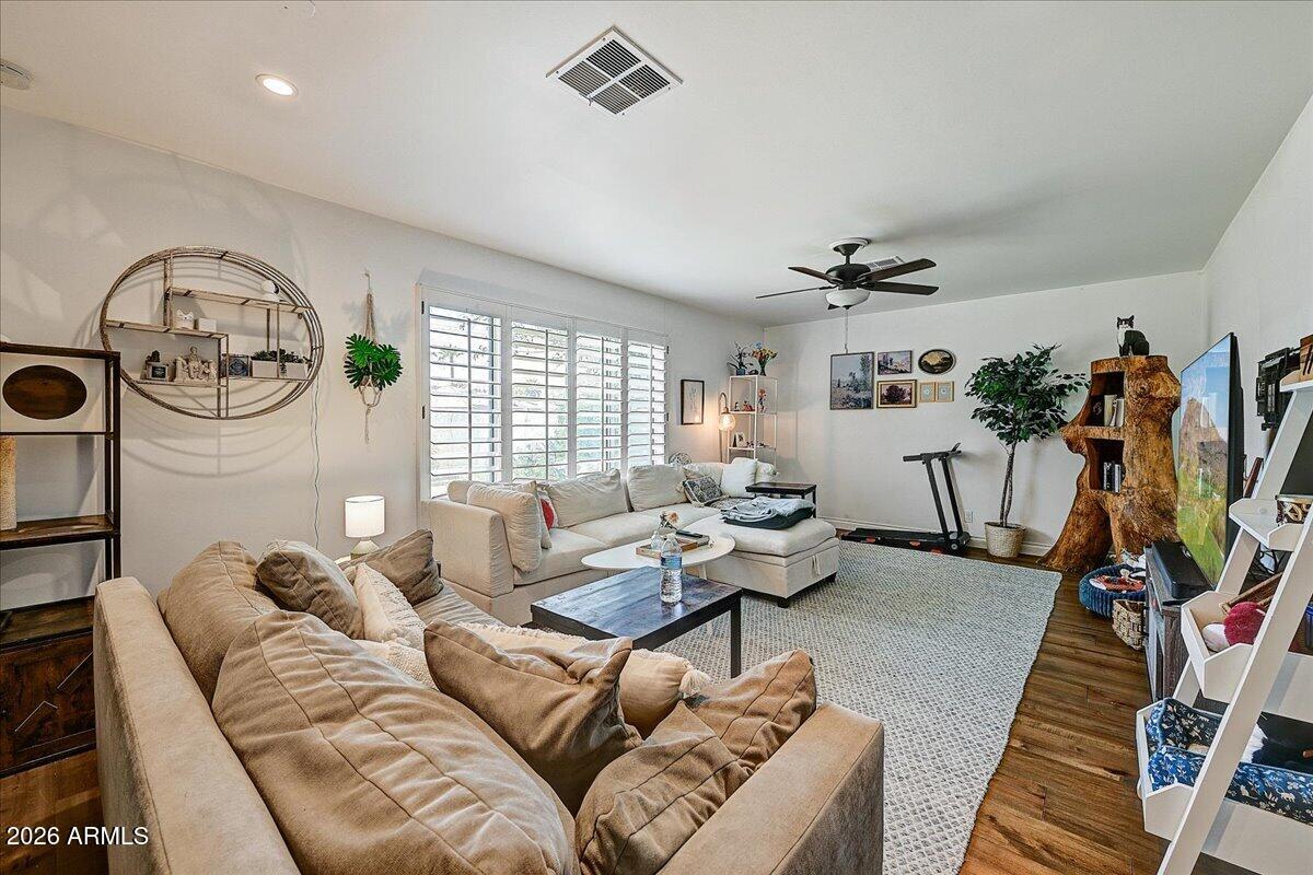 607 West 15th Street Tempe, AZ 85281 - Photo 14 of 29 a living room with furniture a window and gym equipment