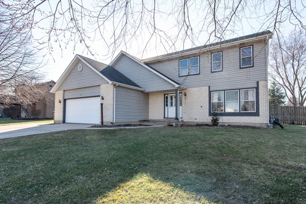 a house that has a big yard in front of it