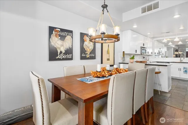 a dining room with furniture and window