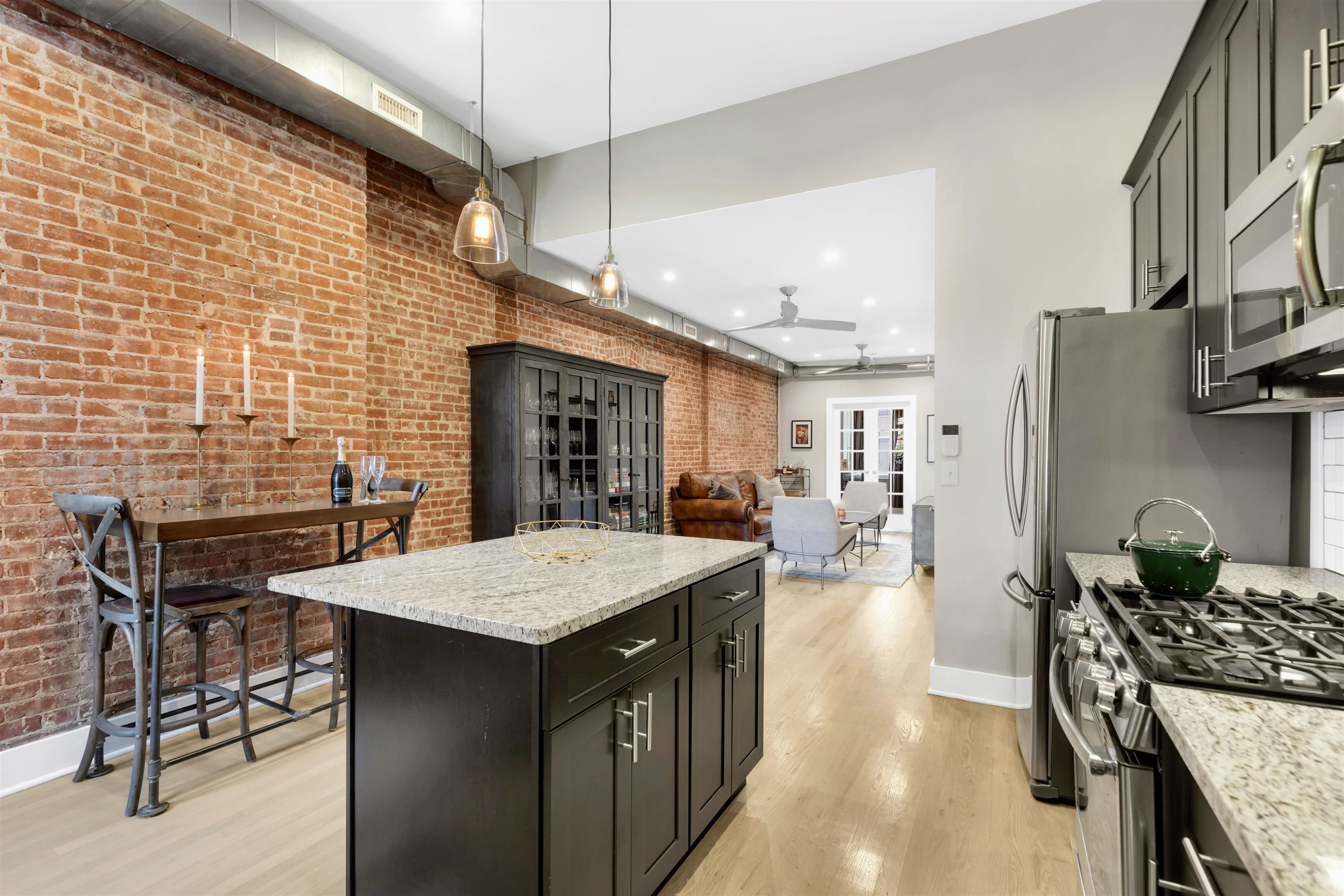 an open kitchen with a table and chairs in it