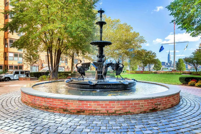 a view of a fountain in the corner of the house