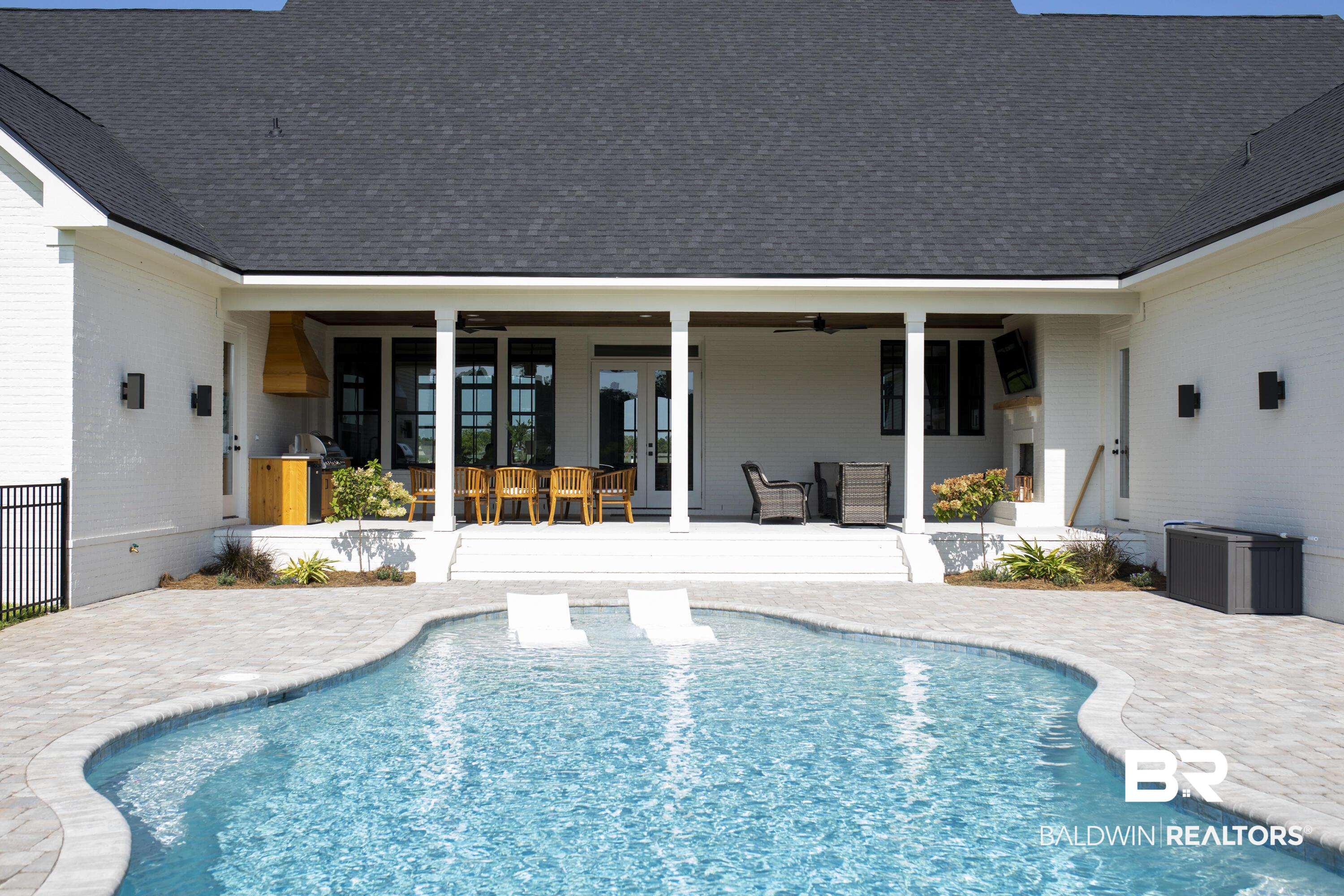 21767 Gallery Boulevard Fairhope, AL 36532 - Photo 71 of 74 Swimming pool with ceiling fan, a patio, french doors, and area for grilling